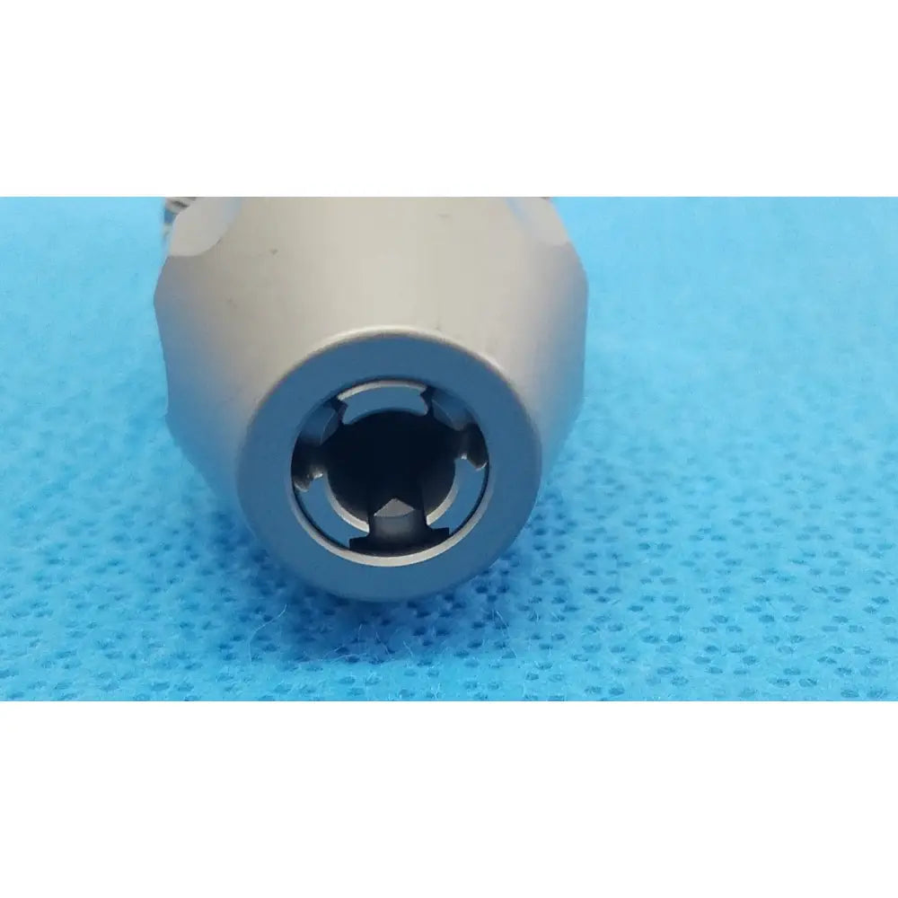Silver-colored metal drill bit with machined grooves and hexagonal drive socket for Stryker 8203-133-000 locking keyless chuck