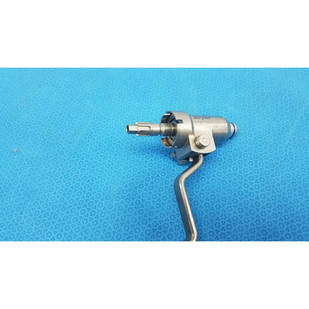 Silver large collet surgical instrument with curved handle and engraved branding for reuse medical orthopedic instruments