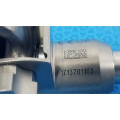 Silver metallic large collet engine component with engraved serial number and qr code for reuse medical orthopedic instruments