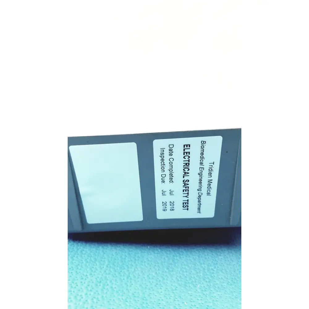 Gray tidien medical electrical safety test device with inspection label on back of stryker air loss pump 2861 unit