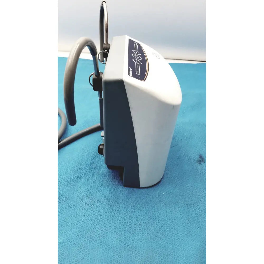 White and gray medical air loss pump with curved hose attachment for patient support by stryker air loss pump 2861