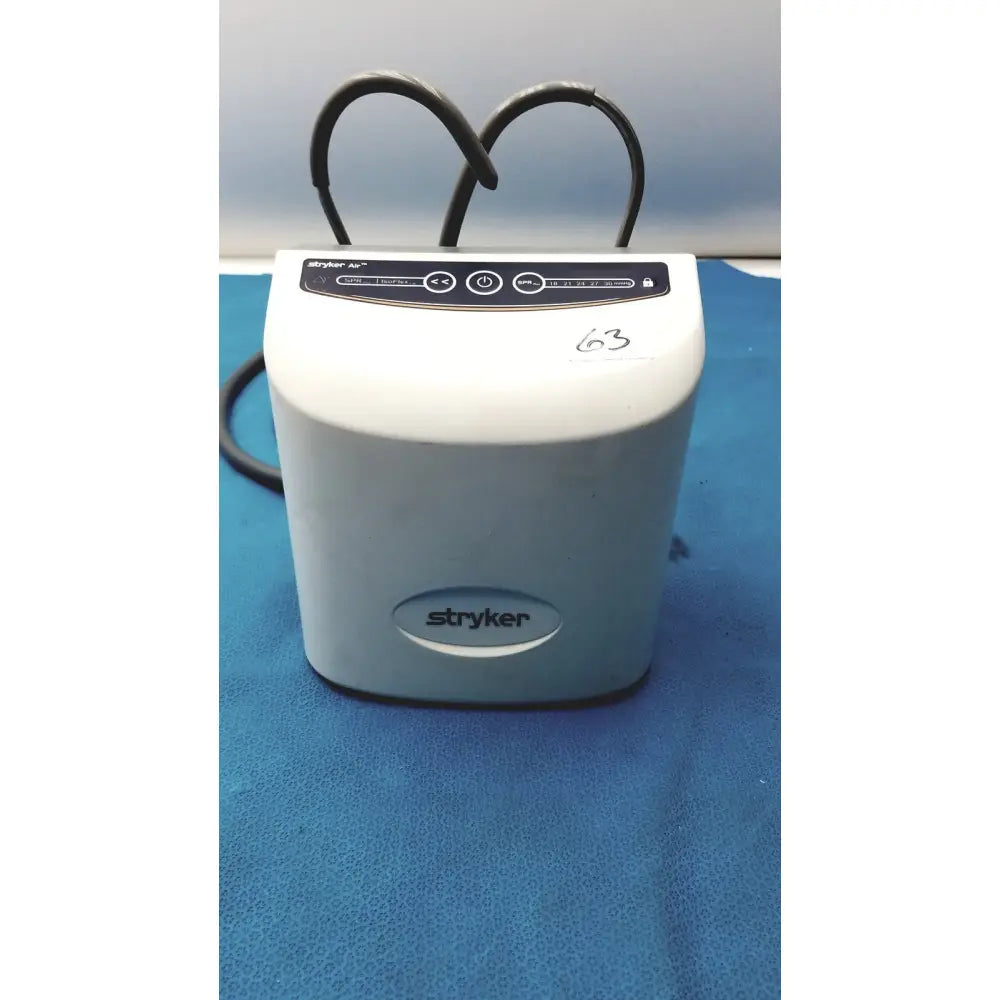 White stryker air loss pump 2861 with black control panel and coiled cables for medical use
