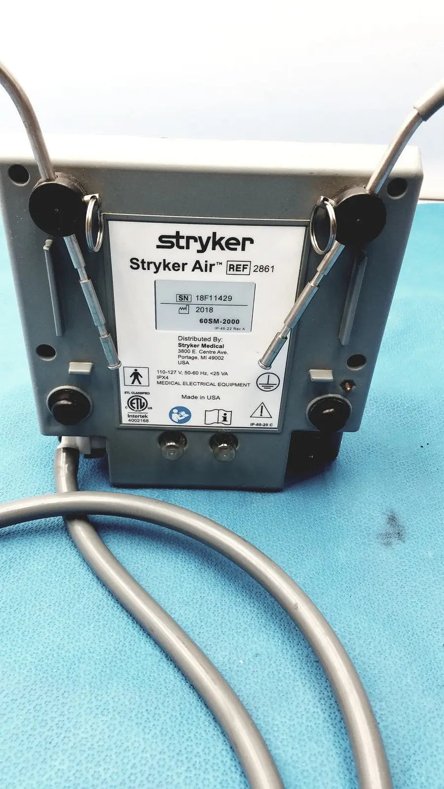 Gray metallic stryker air loss pump 2861 medical electrical unit with silver tubing connected for air loss therapy