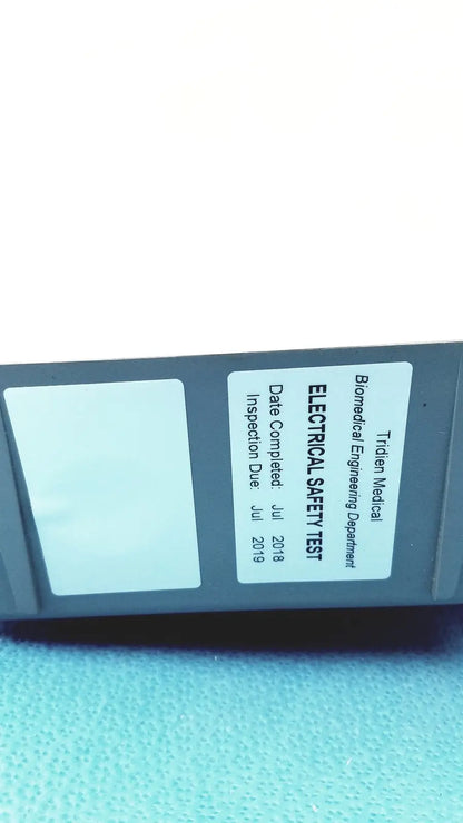 Gray tidien medical electrical safety test device with inspection label on back of stryker air loss pump 2861 unit