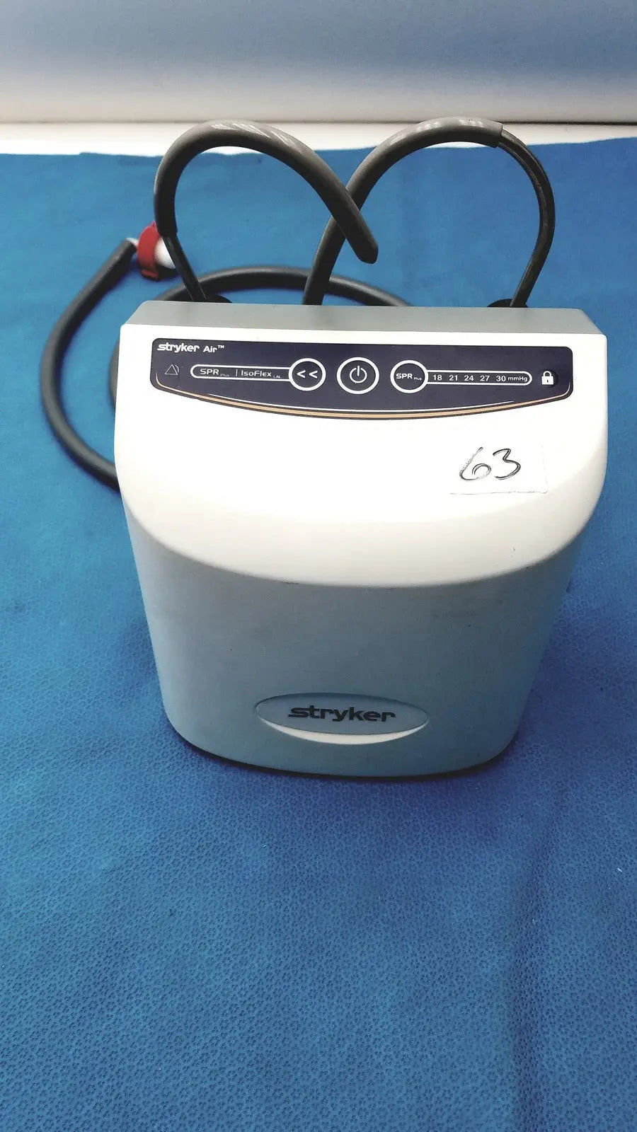 White and gray stryker air loss pump 2861 medical device with black control panel and coiled cables for pressure therapy