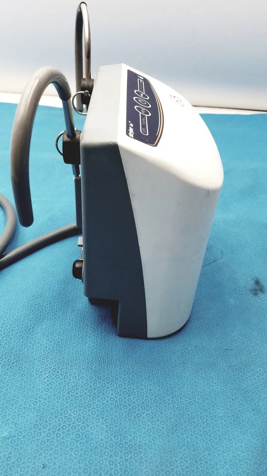 White and gray medical air loss pump with curved hose attachment for patient support by stryker air loss pump 2861