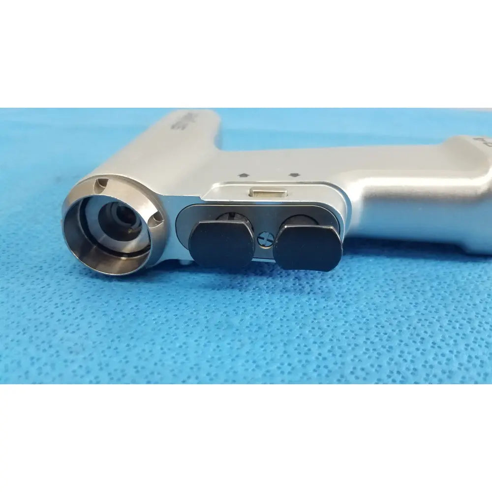 Silver stryker cd4 cordless driver universal handpiece with metallic barrel and black ergonomic grips dual trigger model 4405-000-000