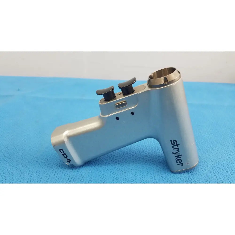 Silver metallic stryker cd4 cordless driver universal handpiece with dual trigger black knobs and cylindrical opening