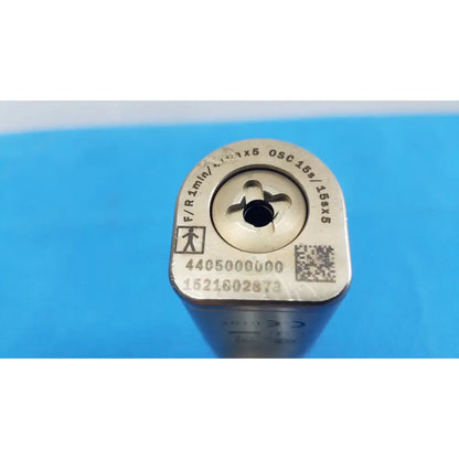 Silver-colored metal tool bit with engraved markings and qr code on top surface for stryker cd4 cordless driver universal handpiece