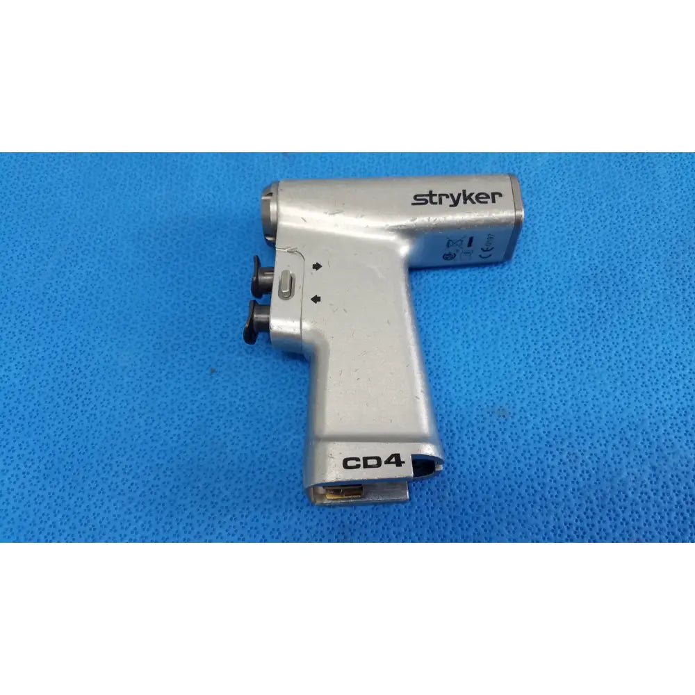 Silver stryker cd4 cordless driver universal handpiece with black knobs and textured grip dual trigger surgical tool