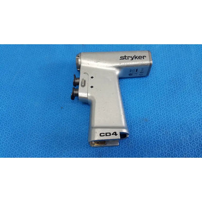 Silver stryker cd4 cordless driver universal handpiece with black knobs and textured grip dual trigger surgical tool