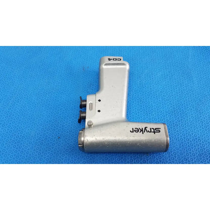 Silver stryker cd4 cordless driver universal handpiece with metallic ergonomic design and black branding for surgical use