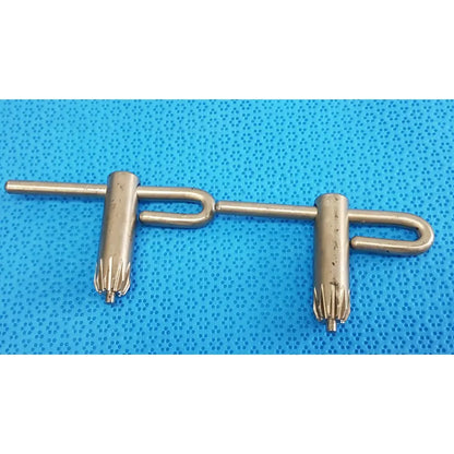 Metallic stryker chuck key with two cylindrical gear-like ends and central connecting bar for surgical drill systems lot of 2