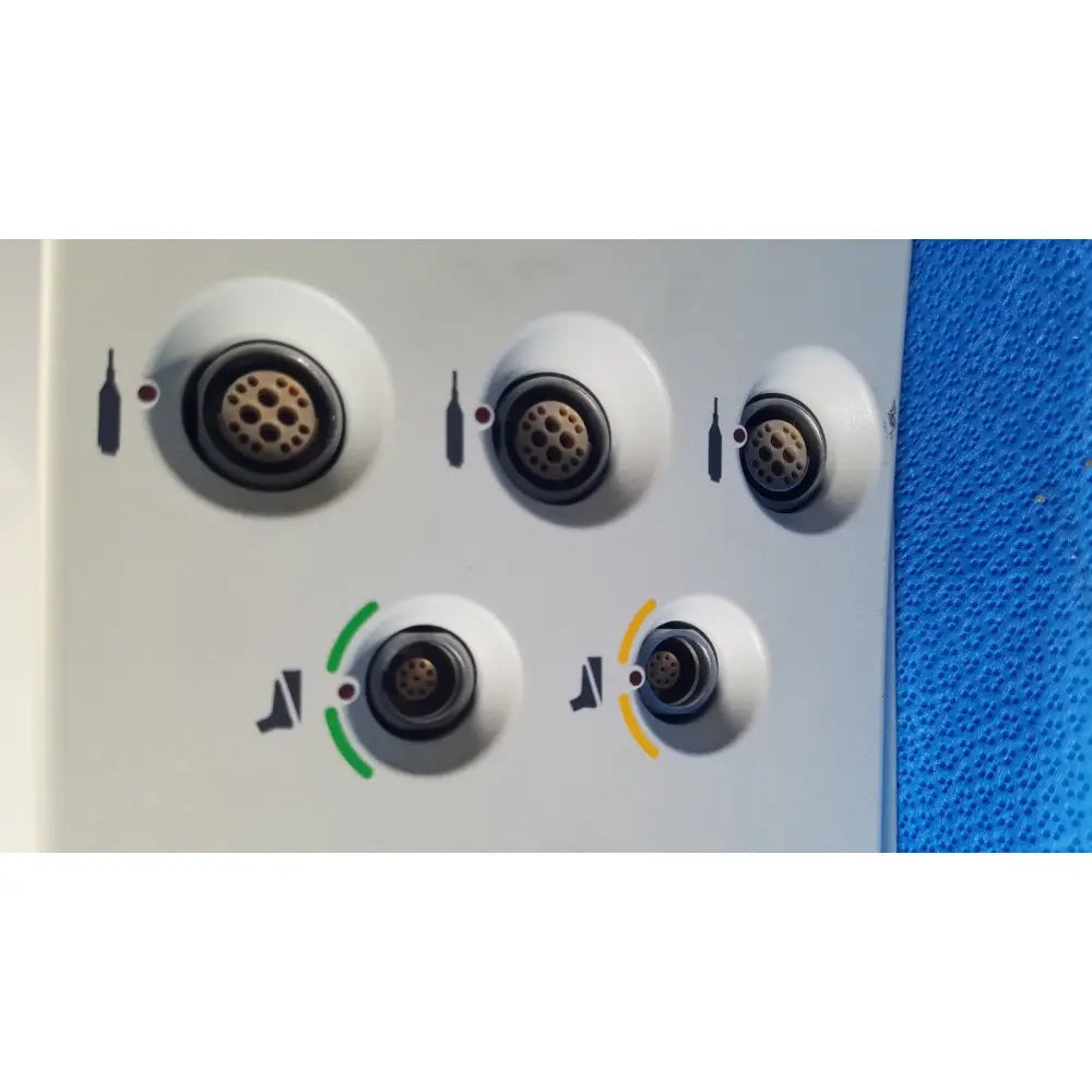 Back side of a white stryker core powered instrument driver panel with five circular ports featuring black rings and gold pins