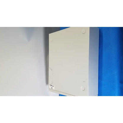 White rectangular stryker core powered electrical junction box mounted on wall for powered instrument driver use