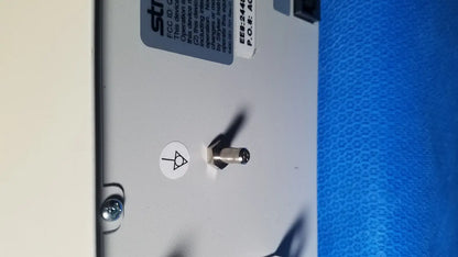 Silver toggle switch on white panel of stryker core powered instrument driver ref 5400-050-000