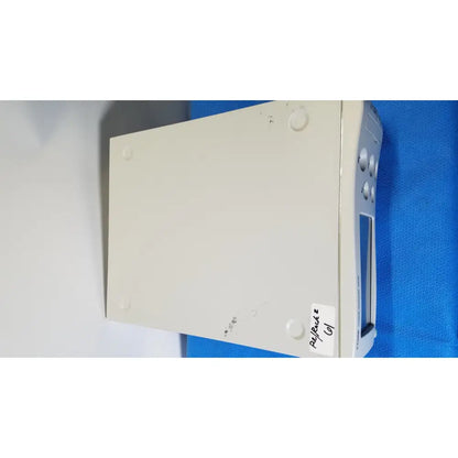 Beige plastic stryker core powered instrument driver with silver buttons and small screen for surgical use