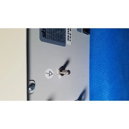 Silver toggle switch on white panel of stryker core powered instrument driver ref 5400-050-000