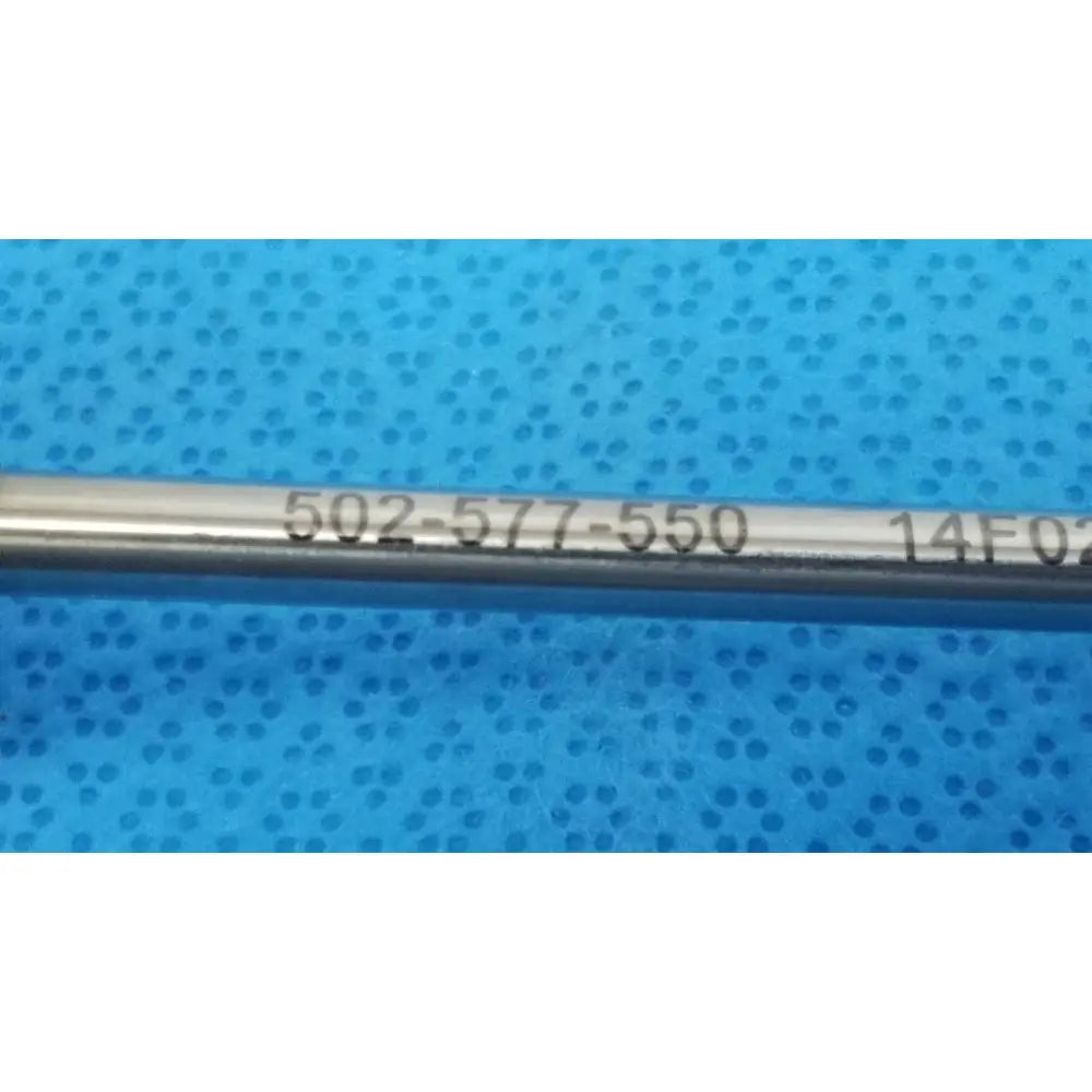 A metallic cylindrical stryker endoscopy 5.8mm surgical trocar with engraved serial numbers for medical use