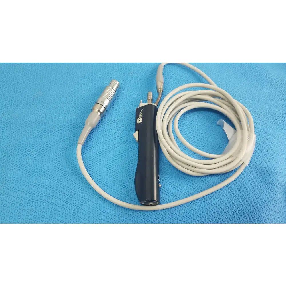 Black ergonomic handle stryker essx microdebrider handpiece with silver connector and coiled white cable for reuse medical equipment