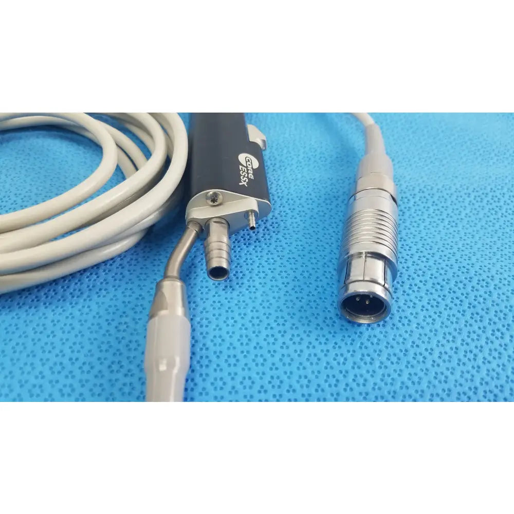 Black and silver Stryker ESSx microdebrider handpiece with coiled gray cable medical equipment for reuse medical equipment