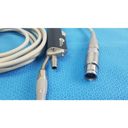 Black and silver Stryker ESSx microdebrider handpiece with coiled gray cable medical equipment for reuse medical equipment
