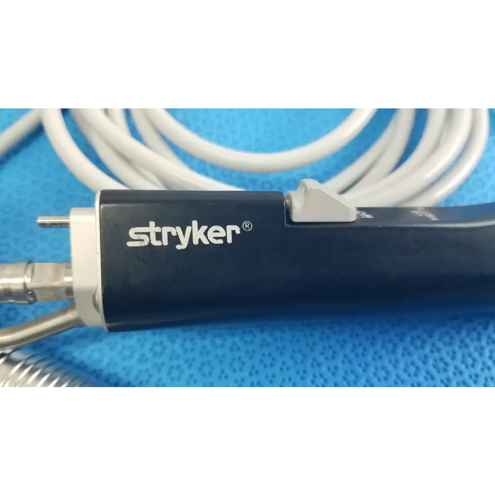 Stryker ESSx microdebrider handpiece with dark blue ergonomic handle featuring white branding for reuse medical equipment