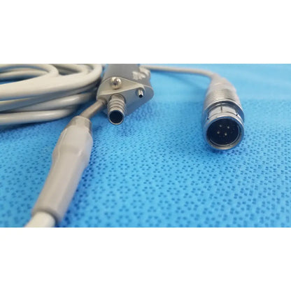 Gray Stryker ESSx microdebrider handpiece with metallic connector and ribbed handle for reuse medical equipment