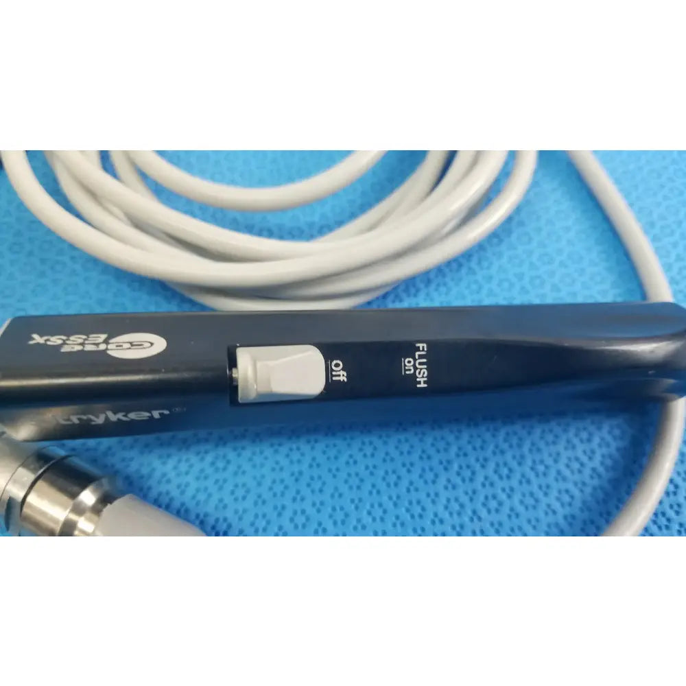 Black Stryker ESSx microdebrider handpiece with white toggle switch off flush for reuse medical equipment by Smiths Medical