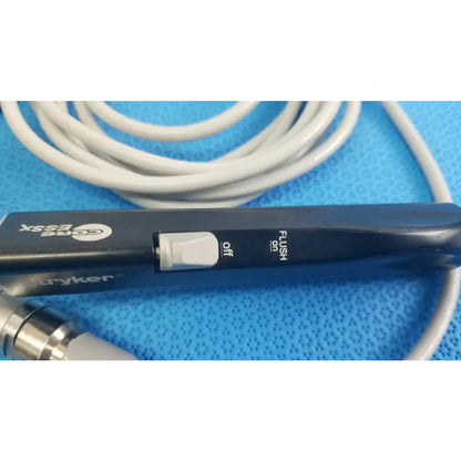 Black Stryker ESSx microdebrider handpiece with white toggle switch off flush for reuse medical equipment by Smiths Medical