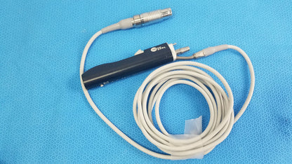 Stryker ESSx microdebrider handpiece black handheld medical equipment with coiled white cable and metallic connectors for reuse medical equipment