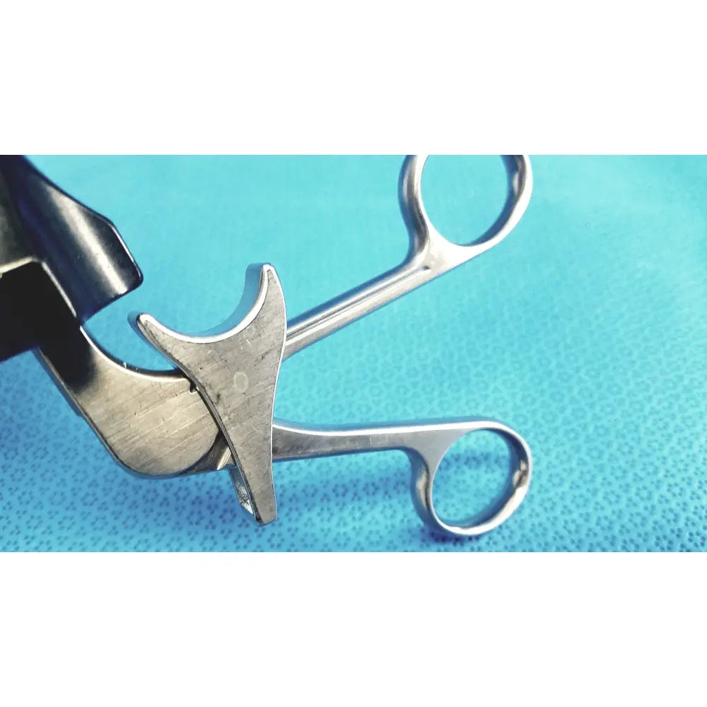 Silver surgical forceps with curved design and polished finish in stryker fenestrrated delicate grasper product