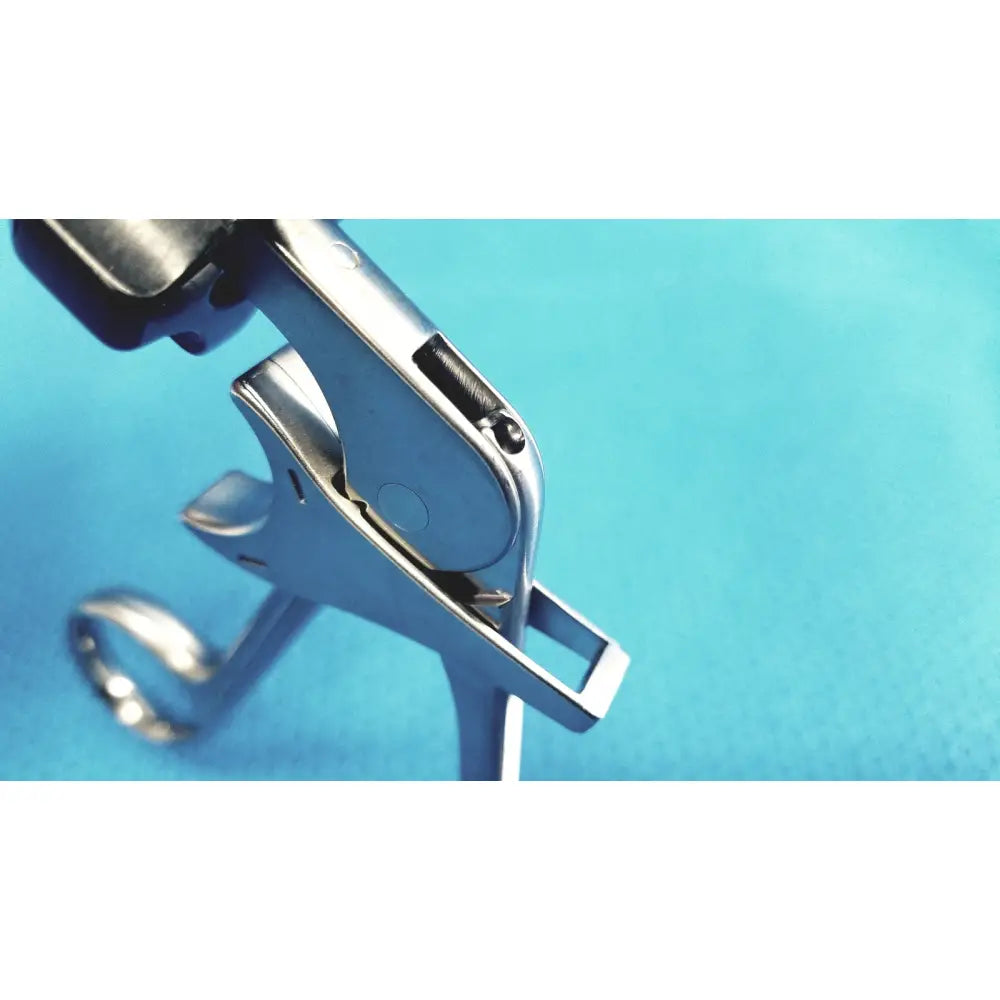 Silver surgical speculum with sleek polished metal finish and black rubberized handles for stryker fenestrrated delicate grasper