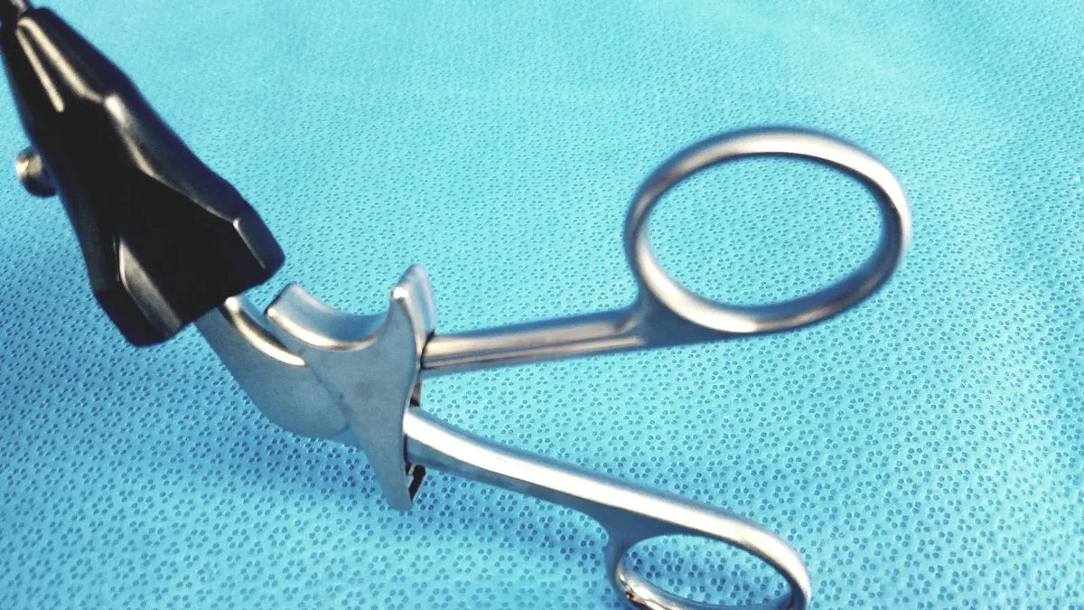 Silver stryker fenestrrated delicate surgical forceps with black textured ergonomic handle for precision grasping