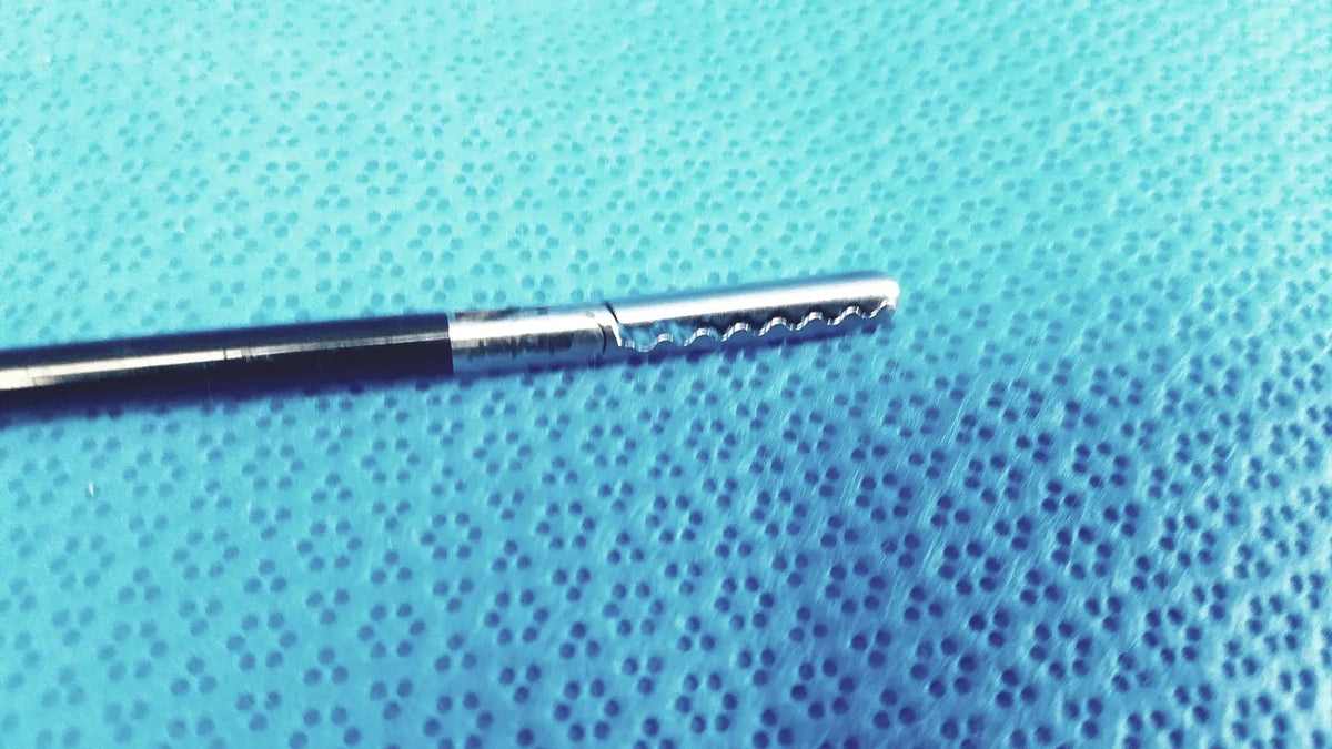 Silver stryker fenestrrated delicate grasper with black handle and serrated tip for precision surgical use