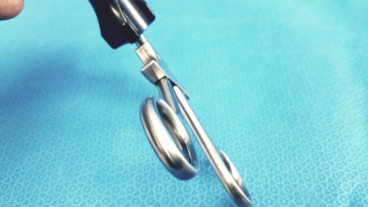 Silver surgical scissors with black ergonomic handles for stryker fenestrrated delicate grasper use