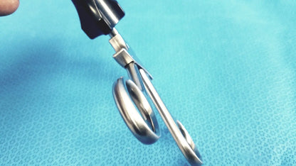 Silver surgical scissors with black ergonomic handles for stryker fenestrrated delicate grasper use