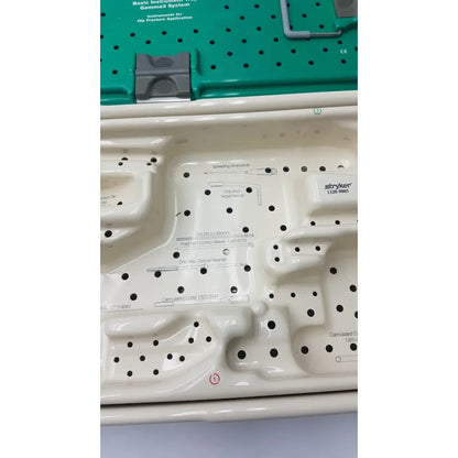 White plastic tray with molded compartments holding stryker gamma3 optional instrument set 1320-9005 for gamma system use