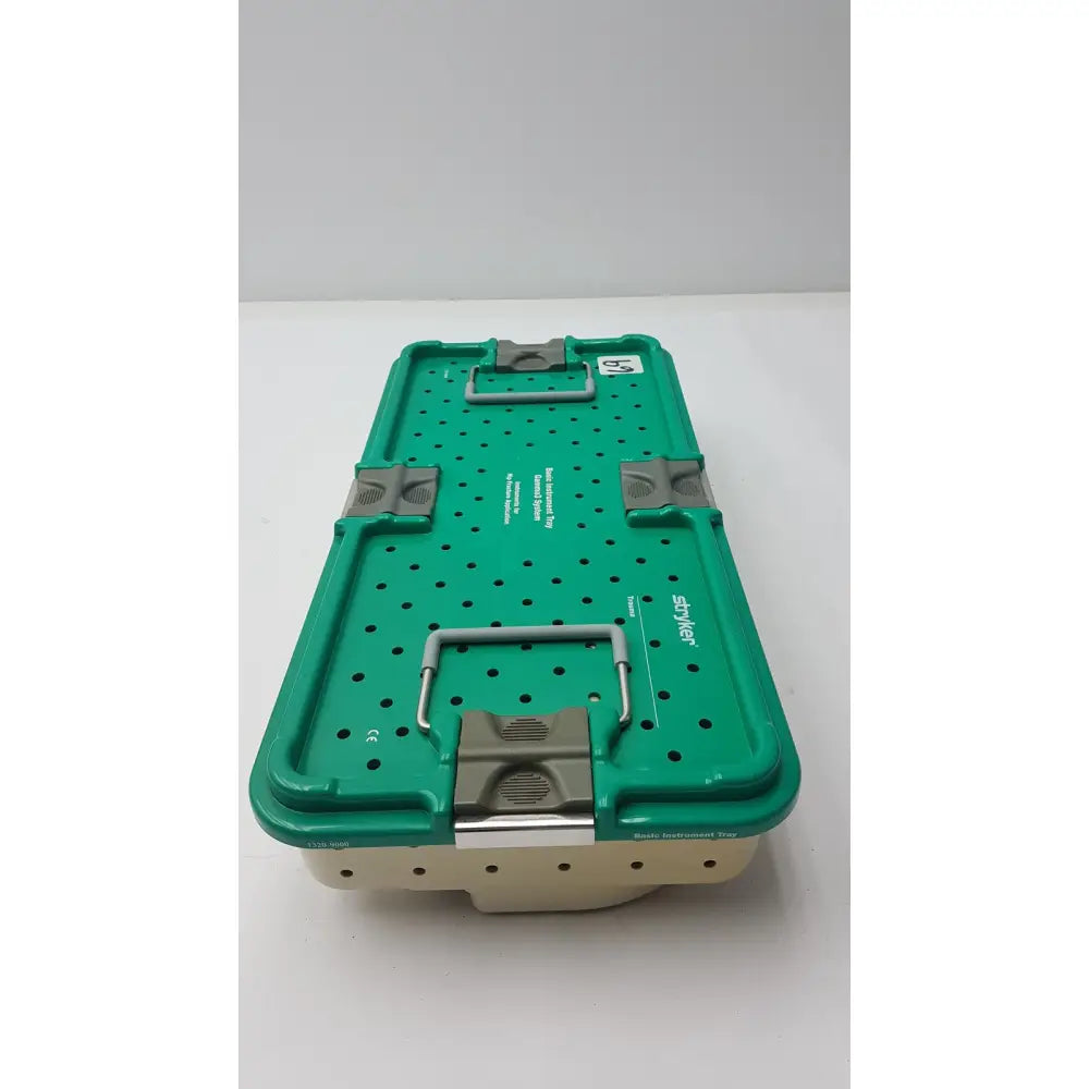 Green and beige stryker gamma3 optional instrument set tray with gray metal latches for sterilization case