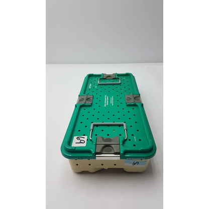 Green plastic optional instrument set tray with gray metal latches and beige base for stryker gamma3 system
