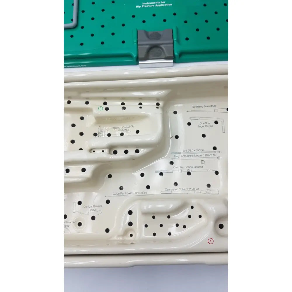 White plastic surgical instrument tray with labeled compartments for stryker gamma3 optional instrument set hip fracture tools