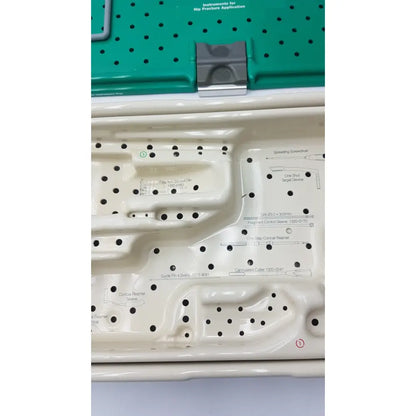 White plastic surgical instrument tray with labeled compartments for stryker gamma3 optional instrument set hip fracture tools