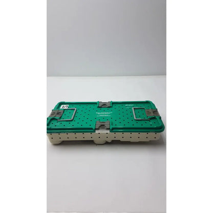 Stryker gamma3 optional instrument set with green and beige perforated metal sterilization case and metal latches