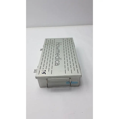 Silver metallic stryker howmedica instrument storage sterilization tray case with perforated lid and howmedica branding