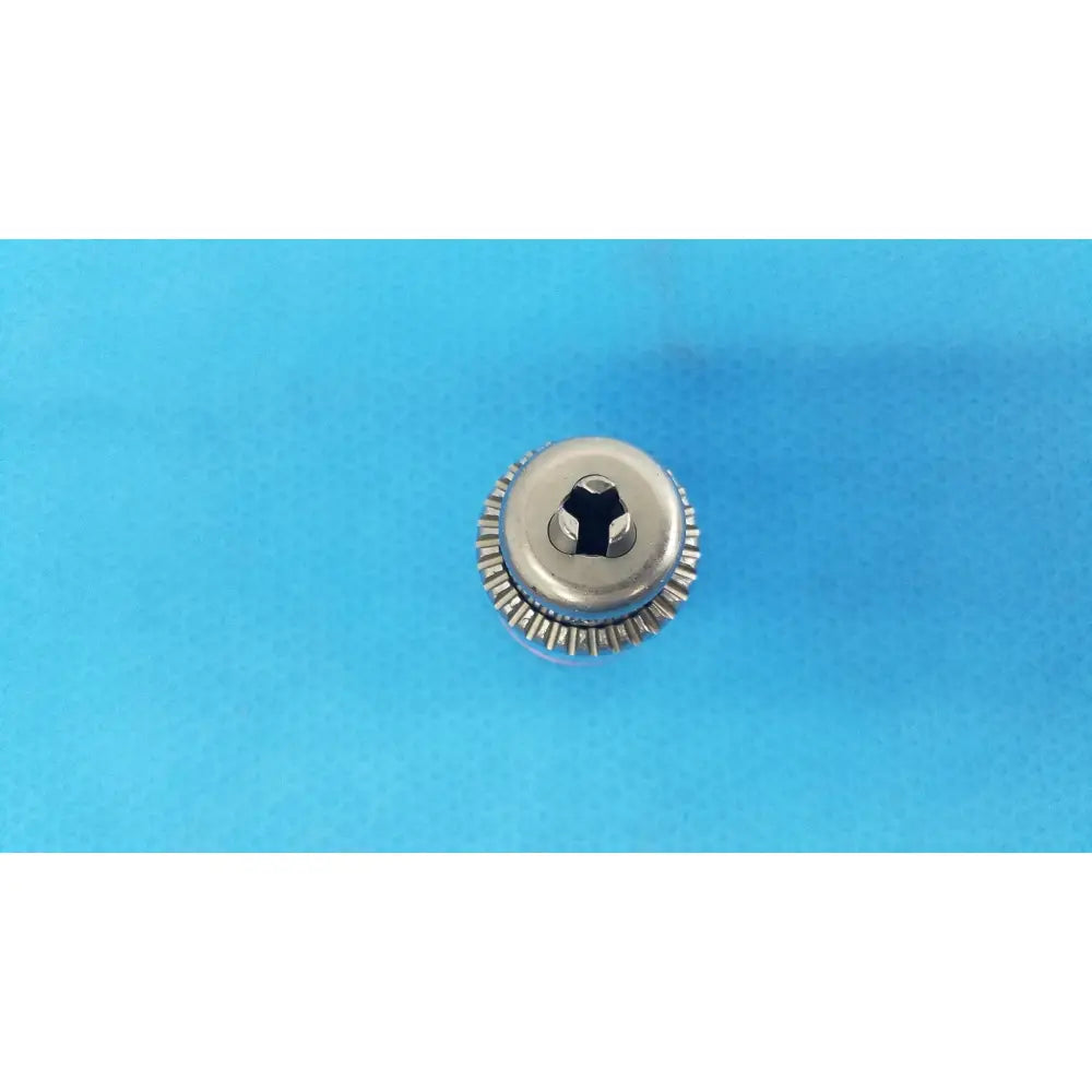 Silver metallic screw head with hexagonal drive and serrated edge for stryker instruments reuse medical 1/4 reamer