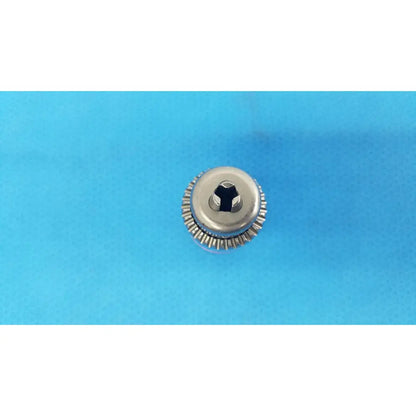 Silver metallic screw head with hexagonal drive and serrated edge for stryker instruments reuse medical 1/4 reamer