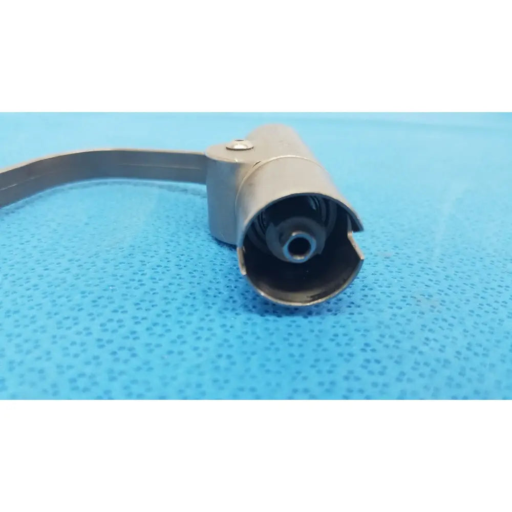 Gray metallic cylindrical wire collet attachment with curved metal band and screw by stryker instruments 4100-62
