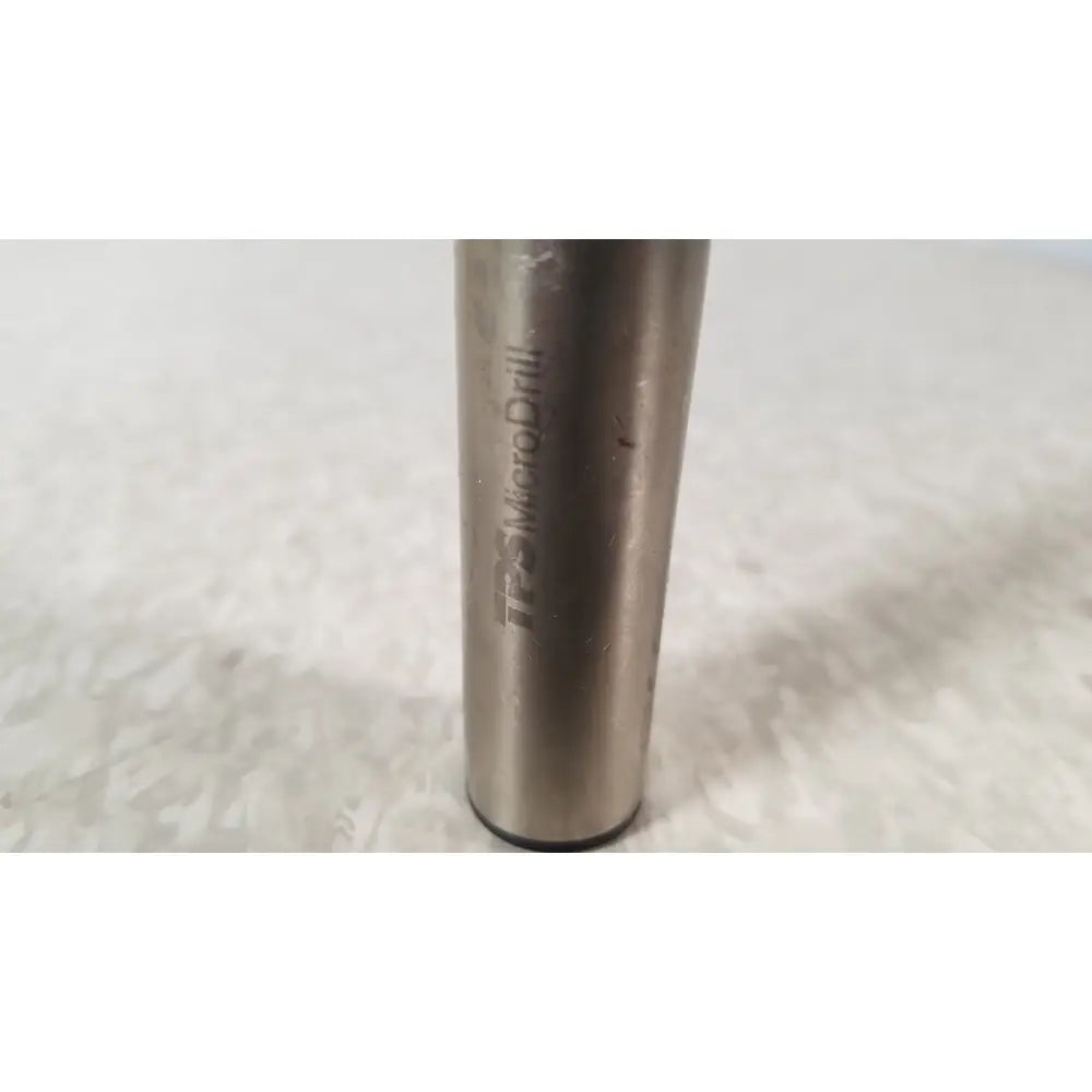 A metallic cylindrical handswitch tps microdrill bit with brushed finish and engraved stryker instruments handswitch branding