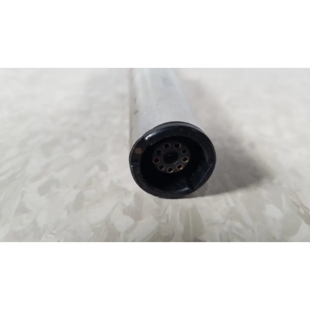 Black circular connector with multiple holes attached to translucent body of stryker instruments handswitch tps microdrill