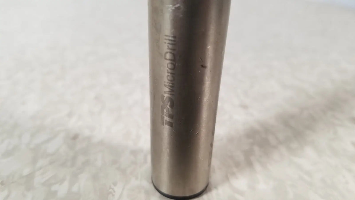 A metallic cylindrical handswitch tps microdrill bit with brushed finish and engraved stryker instruments handswitch branding